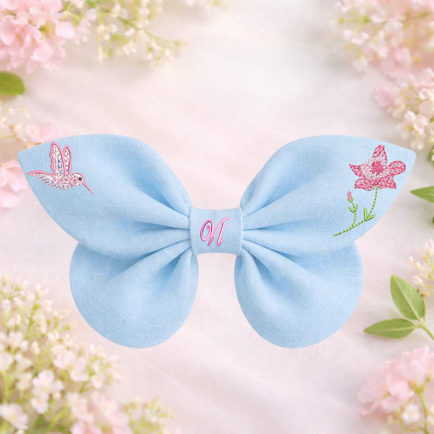 Blue linen bow with hummingbird and flower embroidery. Enchanted Flowers